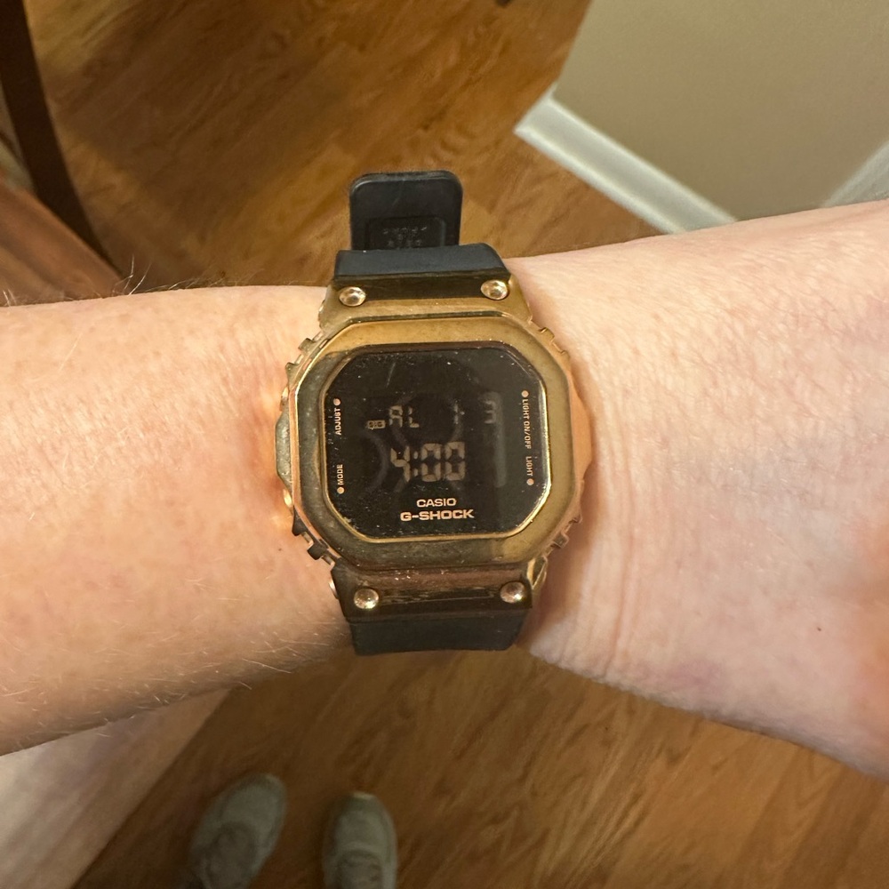 G Shock rose gold and black watch